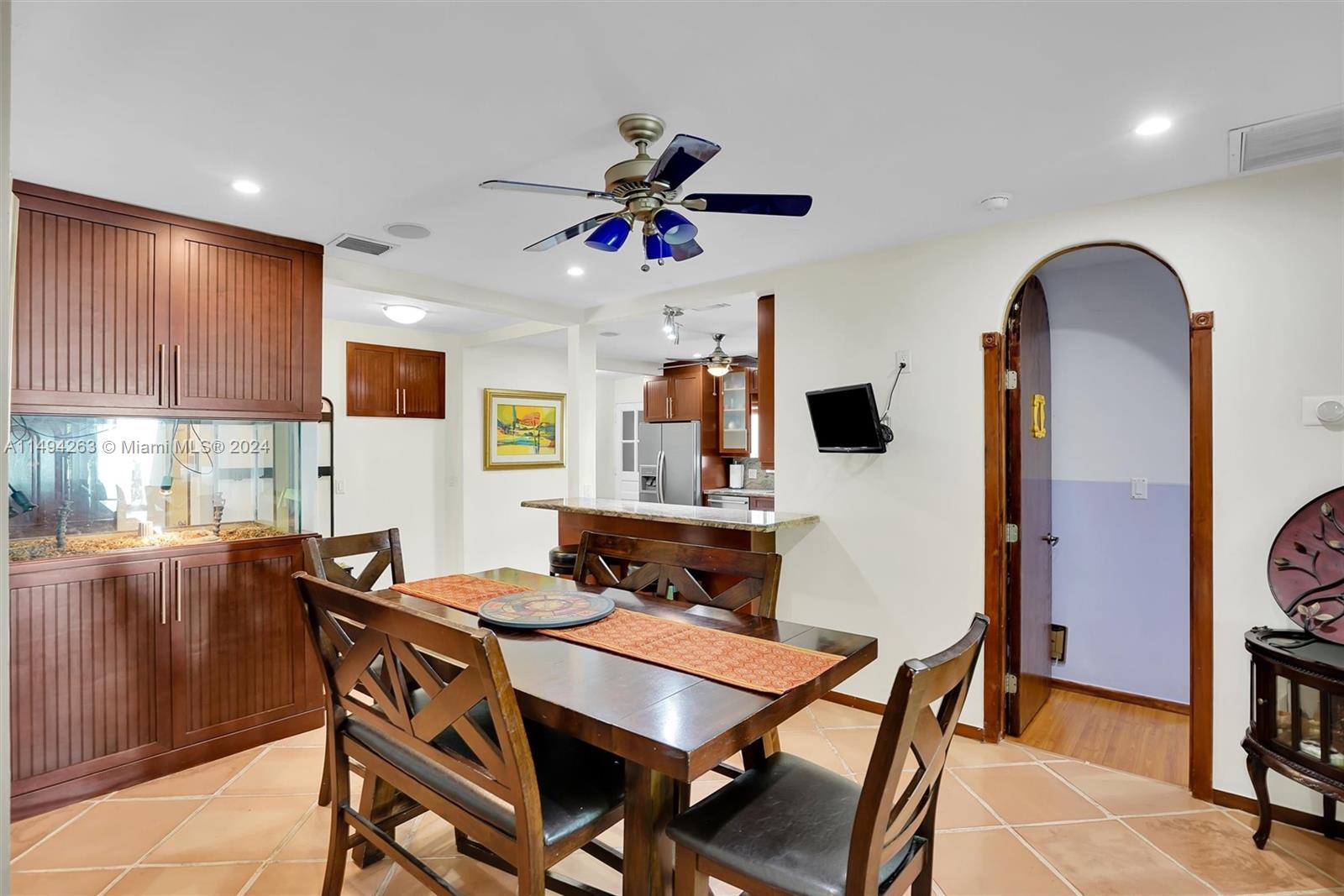 4331 Alton Road Miami Beach, FL 33140 - Photo 8 of 33 a view of a dining room with furniture and a chandelier