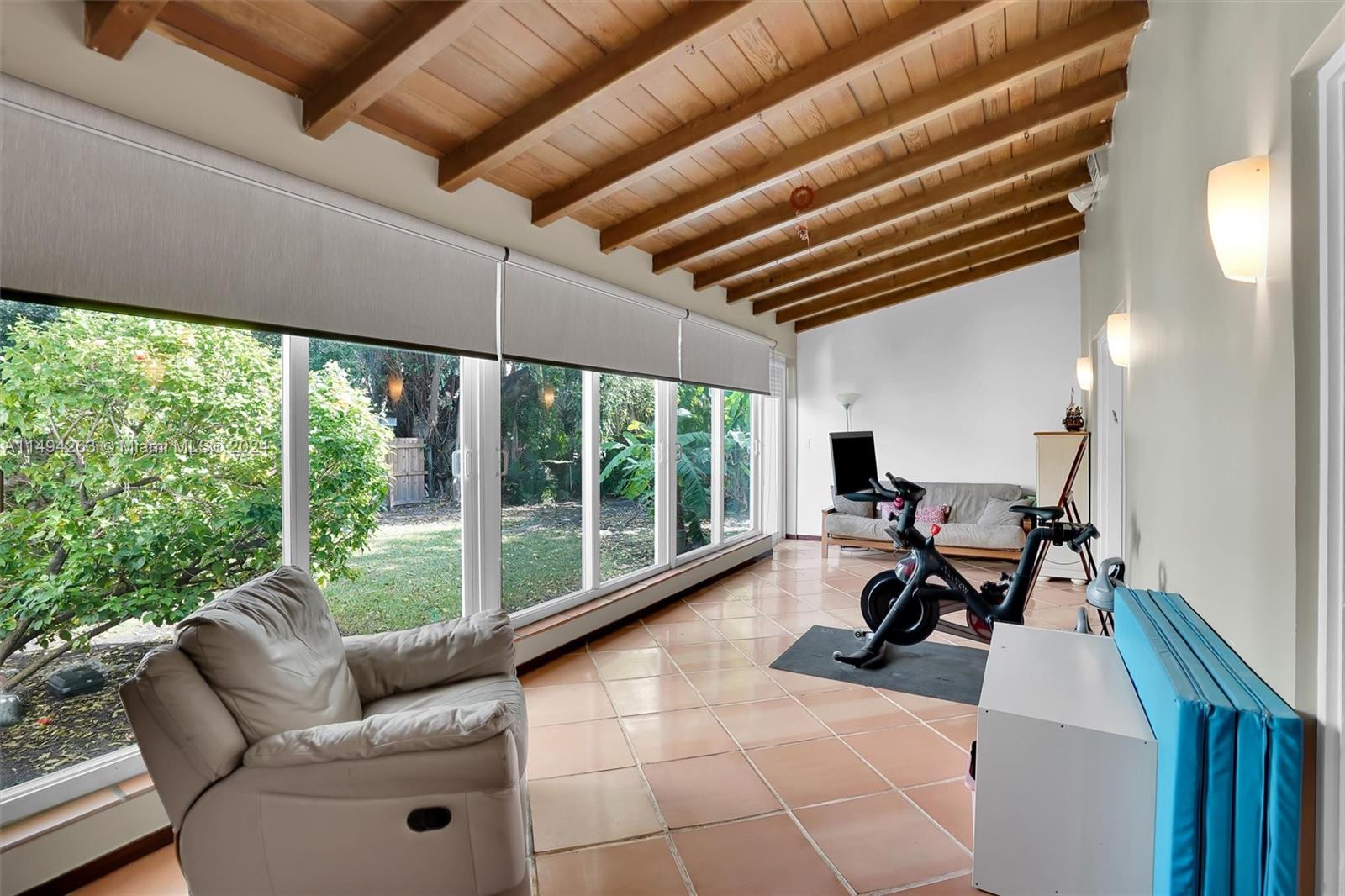4331 Alton Road Miami Beach, FL 33140 - Photo 10 of 33 a living room with furniture and a large window