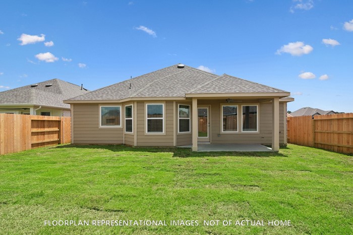 1908 Sleeping Hls Drive Rosenberg, TX 77471 - Photo 4 of 16 a front view of a house with a garden