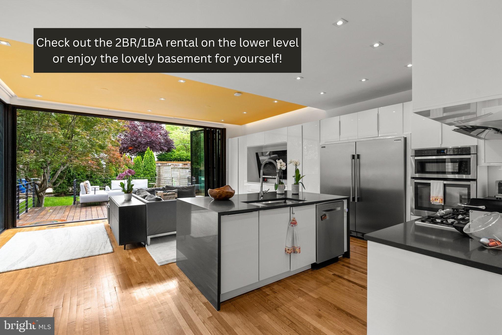 a kitchen with stainless steel appliances granite countertop a sink and cabinets