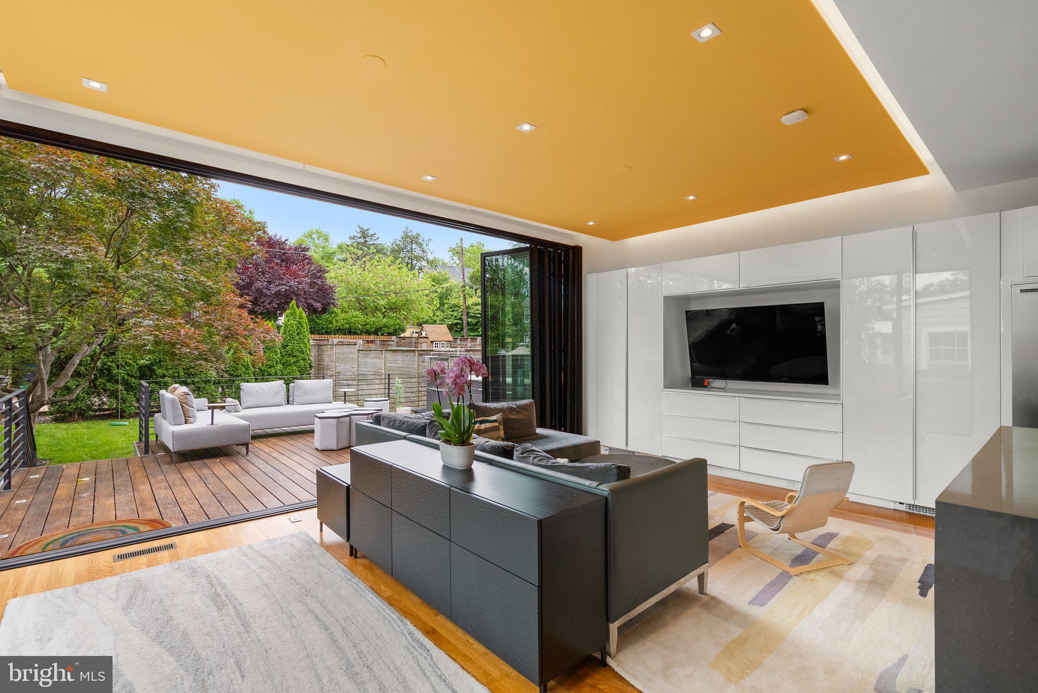 2815 39th Street Northwest Washington, DC 20007 - Photo 12 of 64 a living room with furniture and a flat screen tv