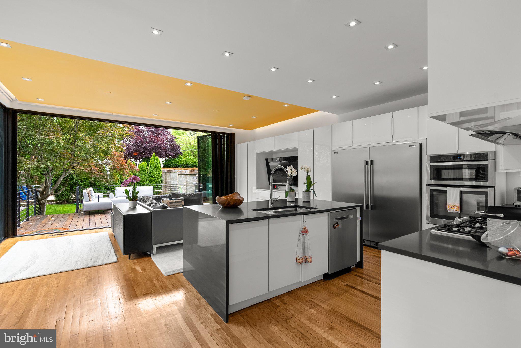 2815 39th Street Northwest Washington, DC 20007 - Photo 13 of 64 a kitchen with stainless steel appliances granite countertop a sink and stove