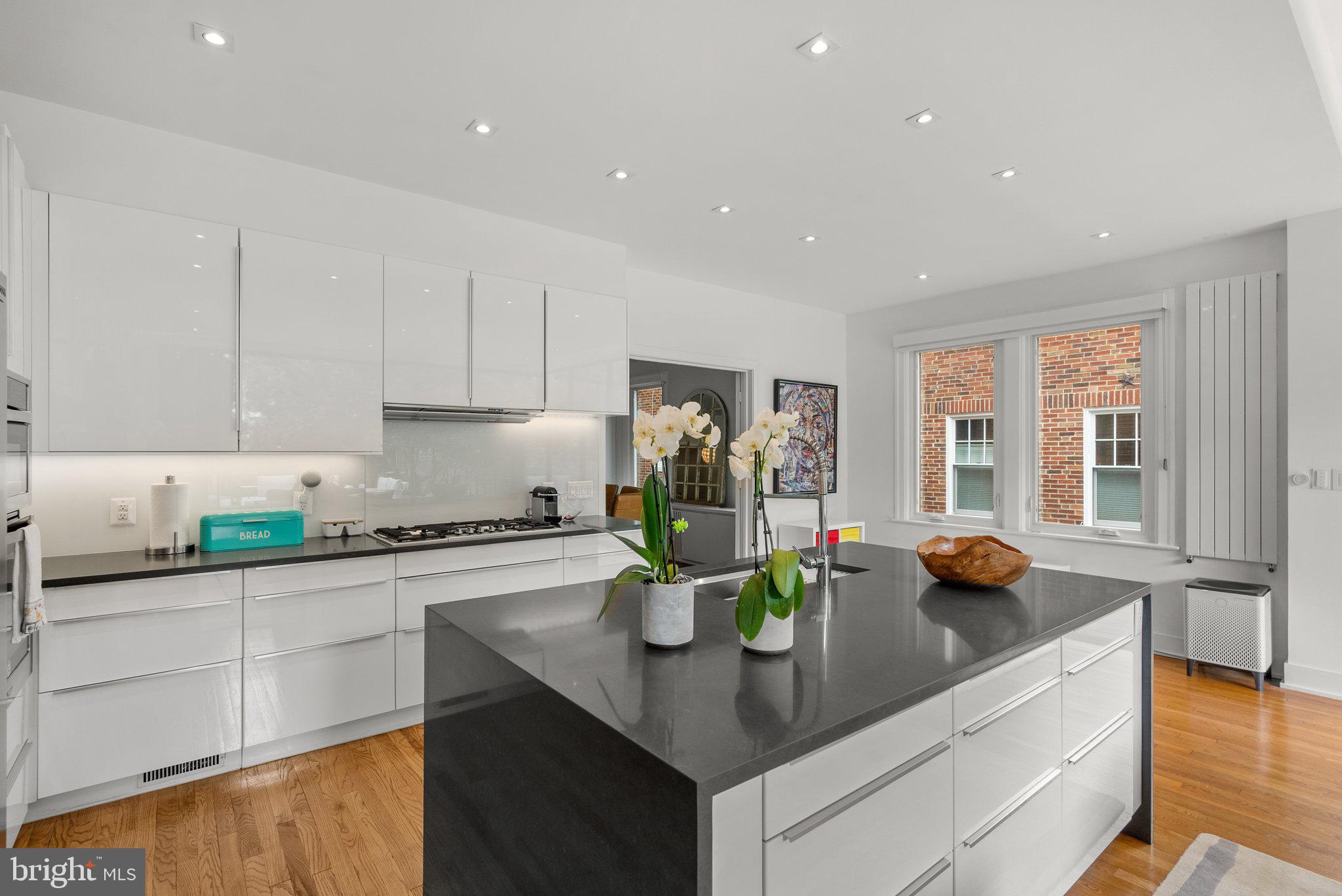 2815 39th Street Northwest Washington, DC 20007 - Photo 16 of 64 a kitchen with a sink a stove and cabinets