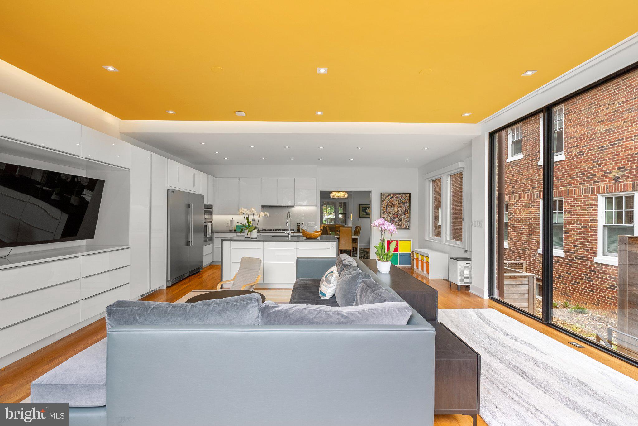 2815 39th Street Northwest Washington, DC 20007 - Photo 21 of 64 a living room with stainless steel appliances furniture a rug and a view of kitchen