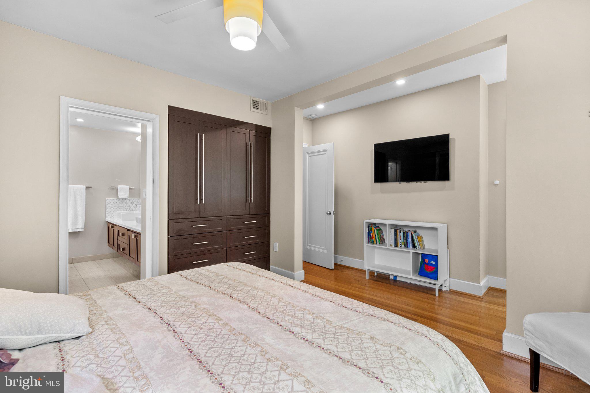 2815 39th Street Northwest Washington, DC 20007 - Photo 26 of 64 a bedroom with a bed and a flat screen tv