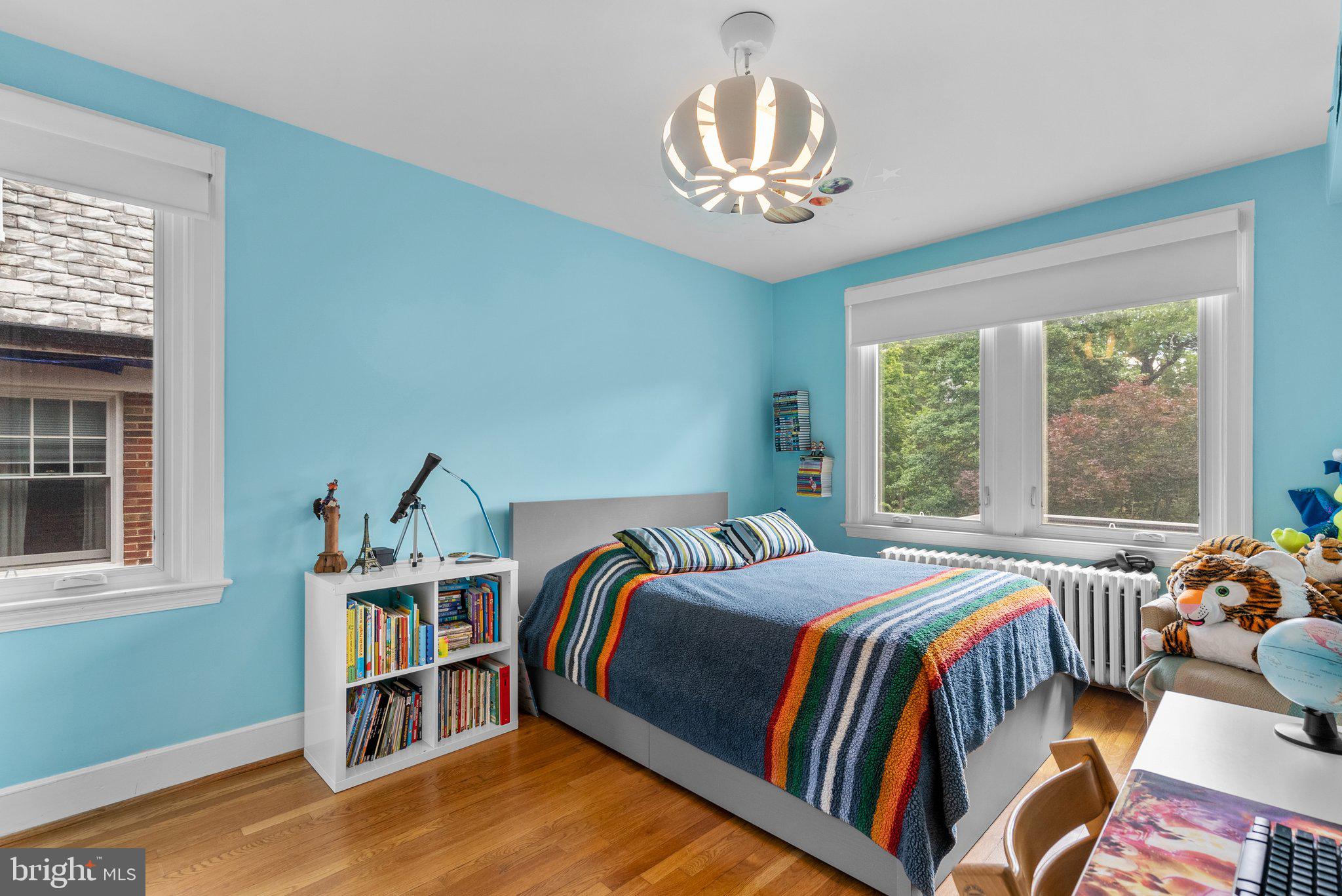 2815 39th Street Northwest Washington, DC 20007 - Photo 31 of 64 a bedroom with a bed and a book shelf