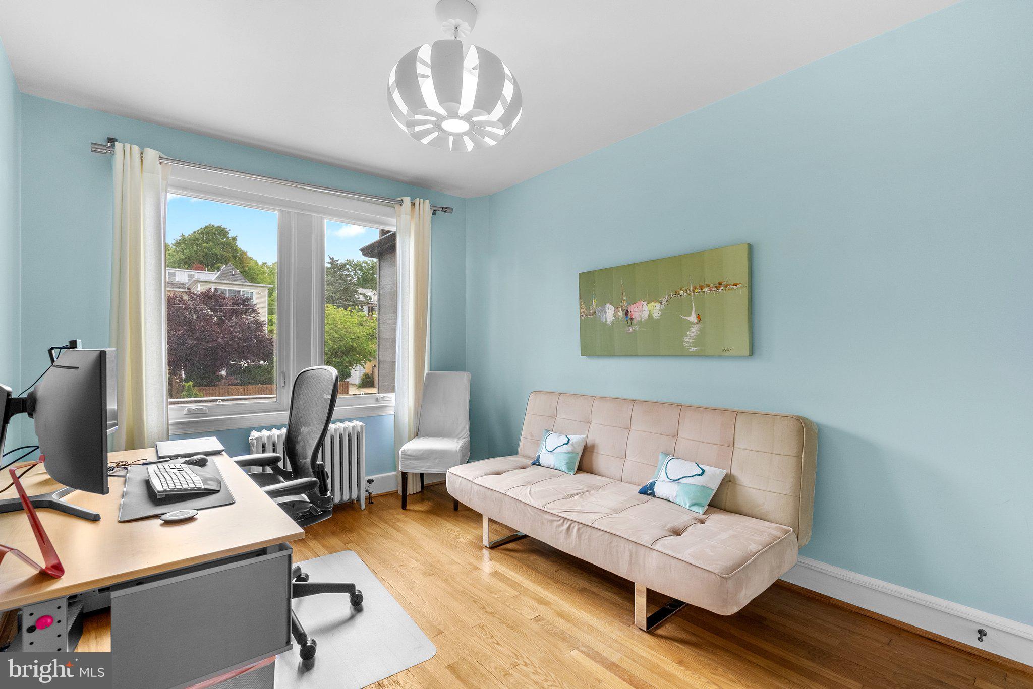 2815 39th Street Northwest Washington, DC 20007 - Photo 33 of 64 a living room with furniture and a chandelier
