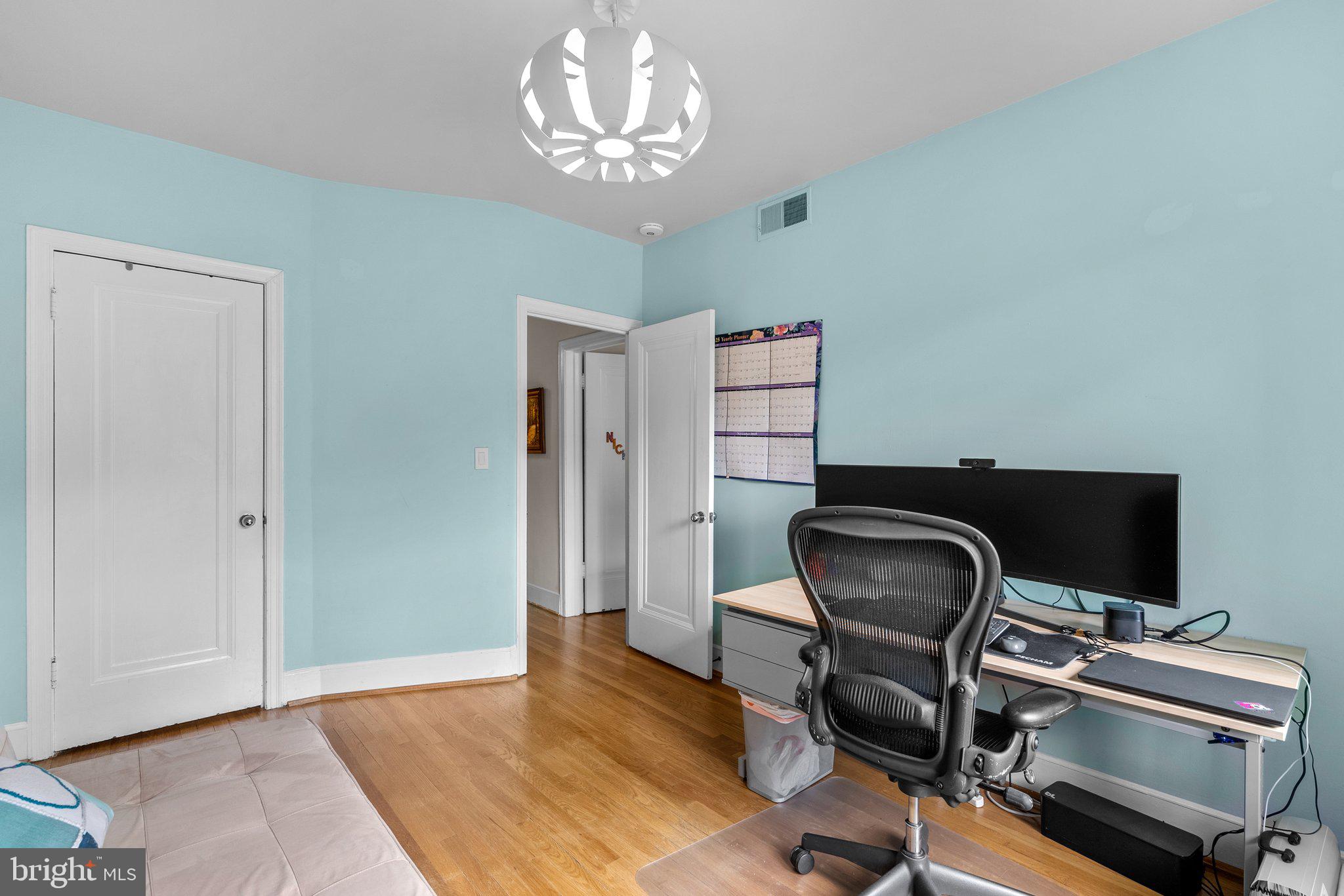 2815 39th Street Northwest Washington, DC 20007 - Photo 34 of 64 a view of a workspace with furniture and a chandelier