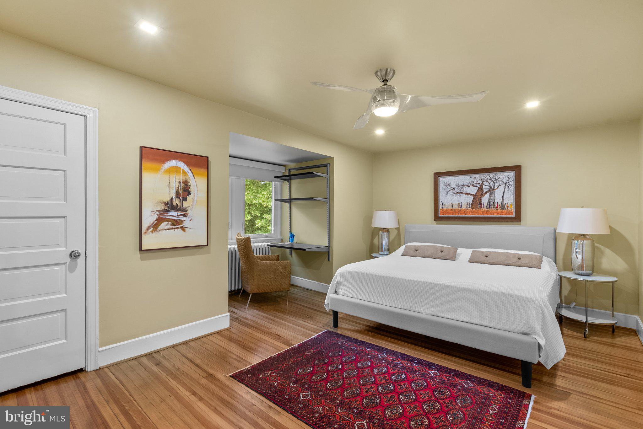 2815 39th Street Northwest Washington, DC 20007 - Photo 37 of 64 a bedroom with a bed and a dresser with wooden floor