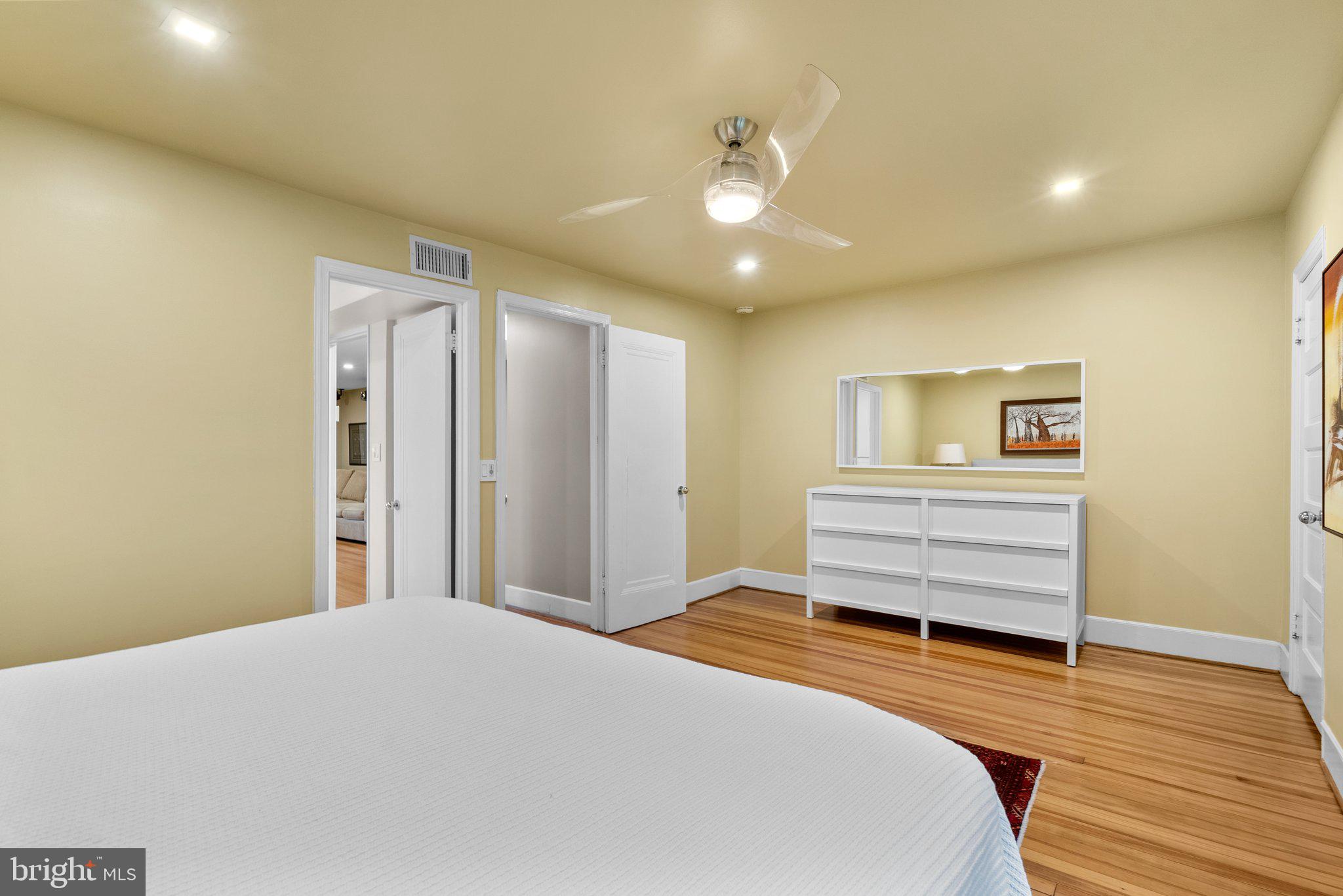 2815 39th Street Northwest Washington, DC 20007 - Photo 38 of 64 a bedroom with a bed and a chandelier