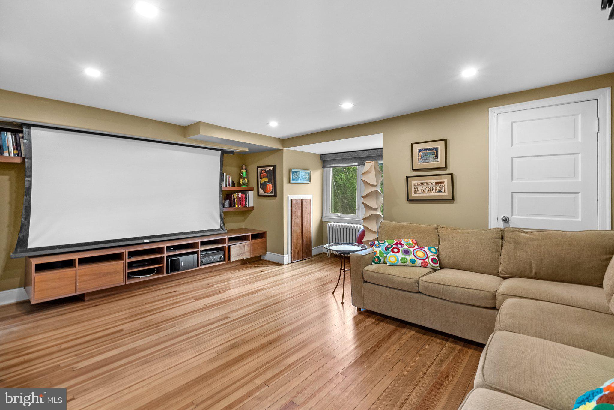 2815 39th Street Northwest Washington, DC 20007 - Photo 39 of 64 a living room with furniture and a flat screen tv