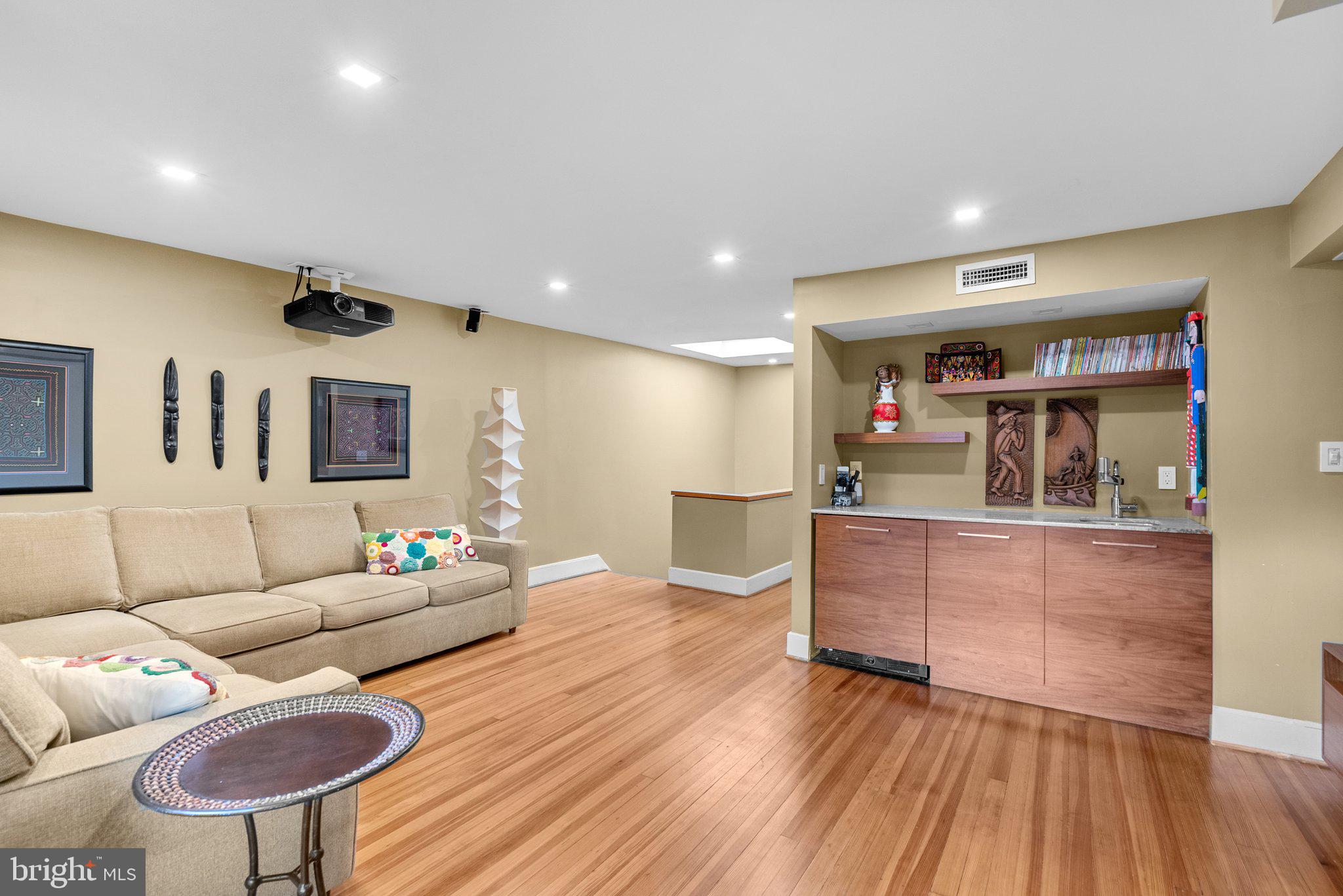 2815 39th Street Northwest Washington, DC 20007 - Photo 40 of 64 a living room with furniture and a wooden floor