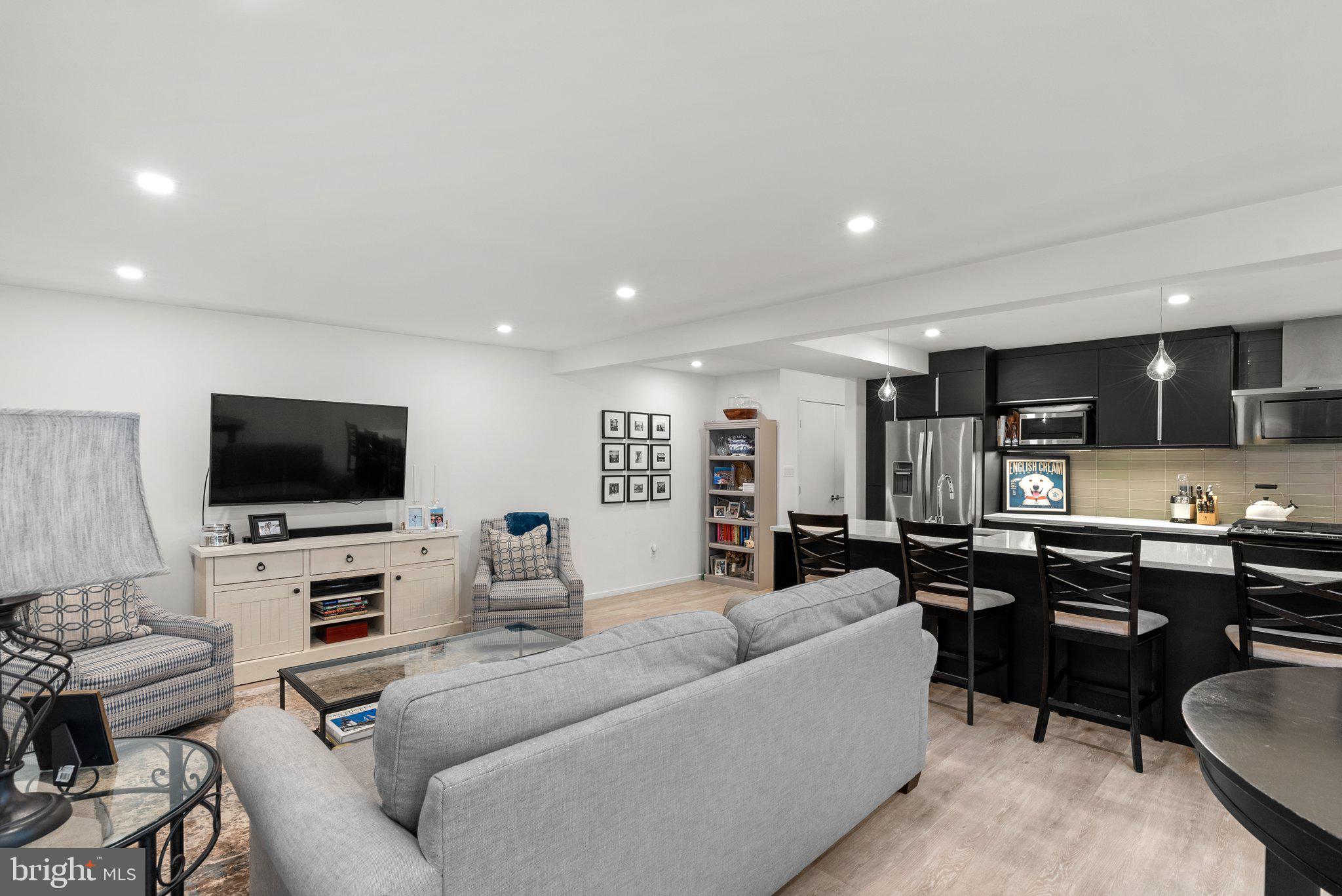 2815 39th Street Northwest Washington, DC 20007 - Photo 44 of 64 a living room with furniture and a flat screen tv
