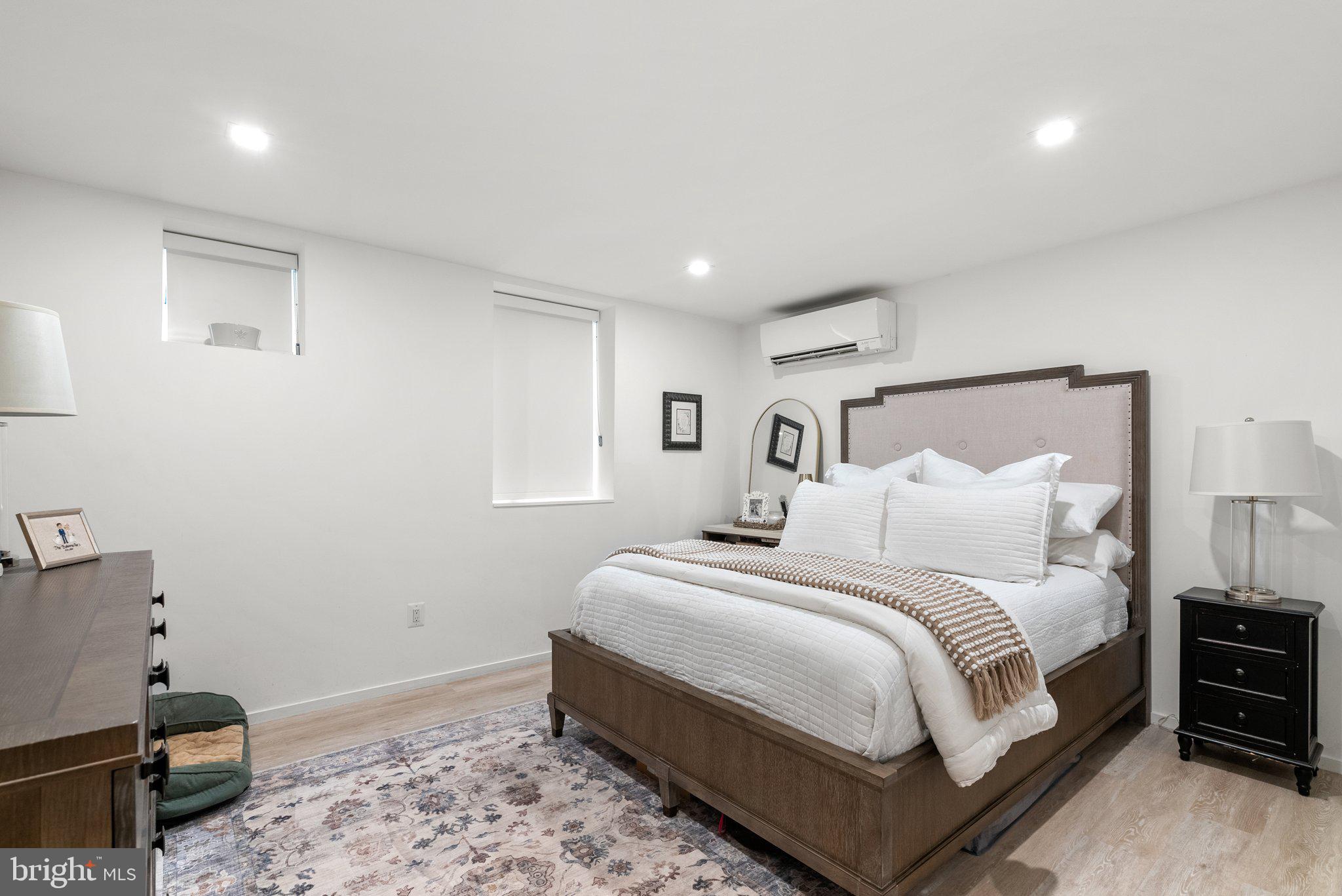 2815 39th Street Northwest Washington, DC 20007 - Photo 50 of 64 a large bedroom with a bed and wooden floor
