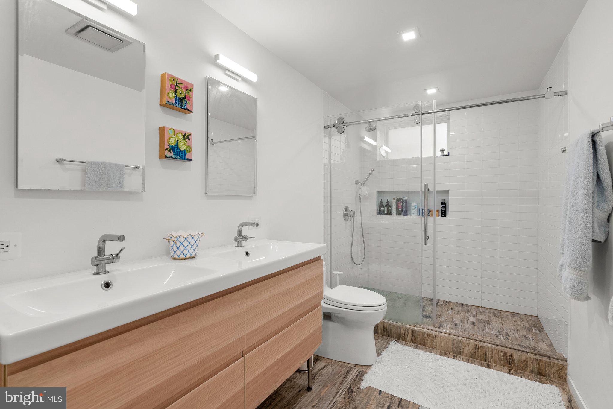 2815 39th Street Northwest Washington, DC 20007 - Photo 52 of 64 a bathroom with a sink a toilet and shower