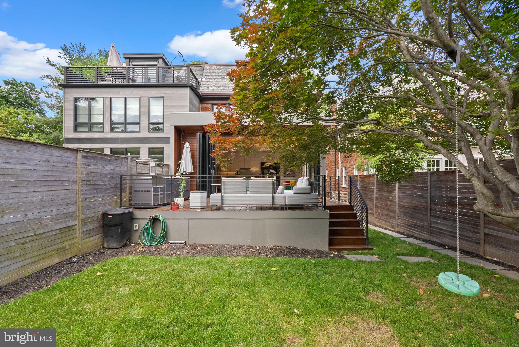 2815 39th Street Northwest Washington, DC 20007 - Photo 57 of 64 a view of a house with a backyard and a patio