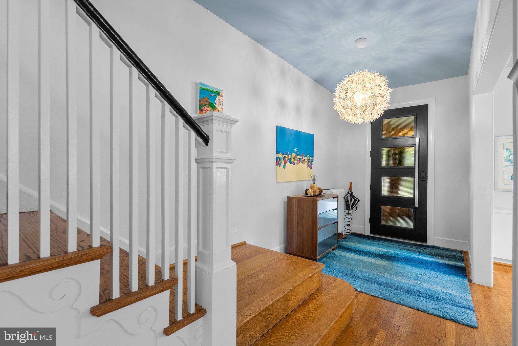2815 39th Street Northwest Washington, DC 20007 - Photo 6 of 64 a view of a livingroom with wooden floor and stairs