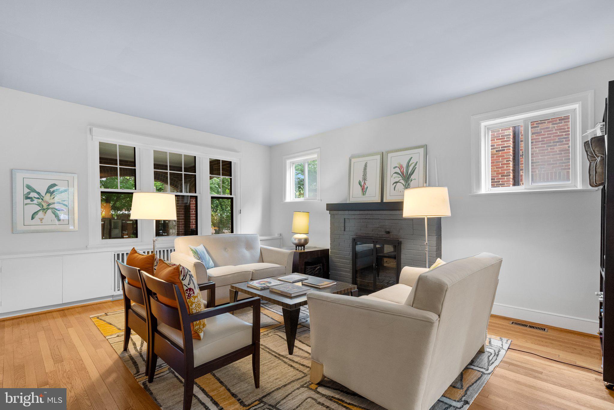2815 39th Street Northwest Washington, DC 20007 - Photo 8 of 64 a living room with furniture a fireplace and a wooden floor