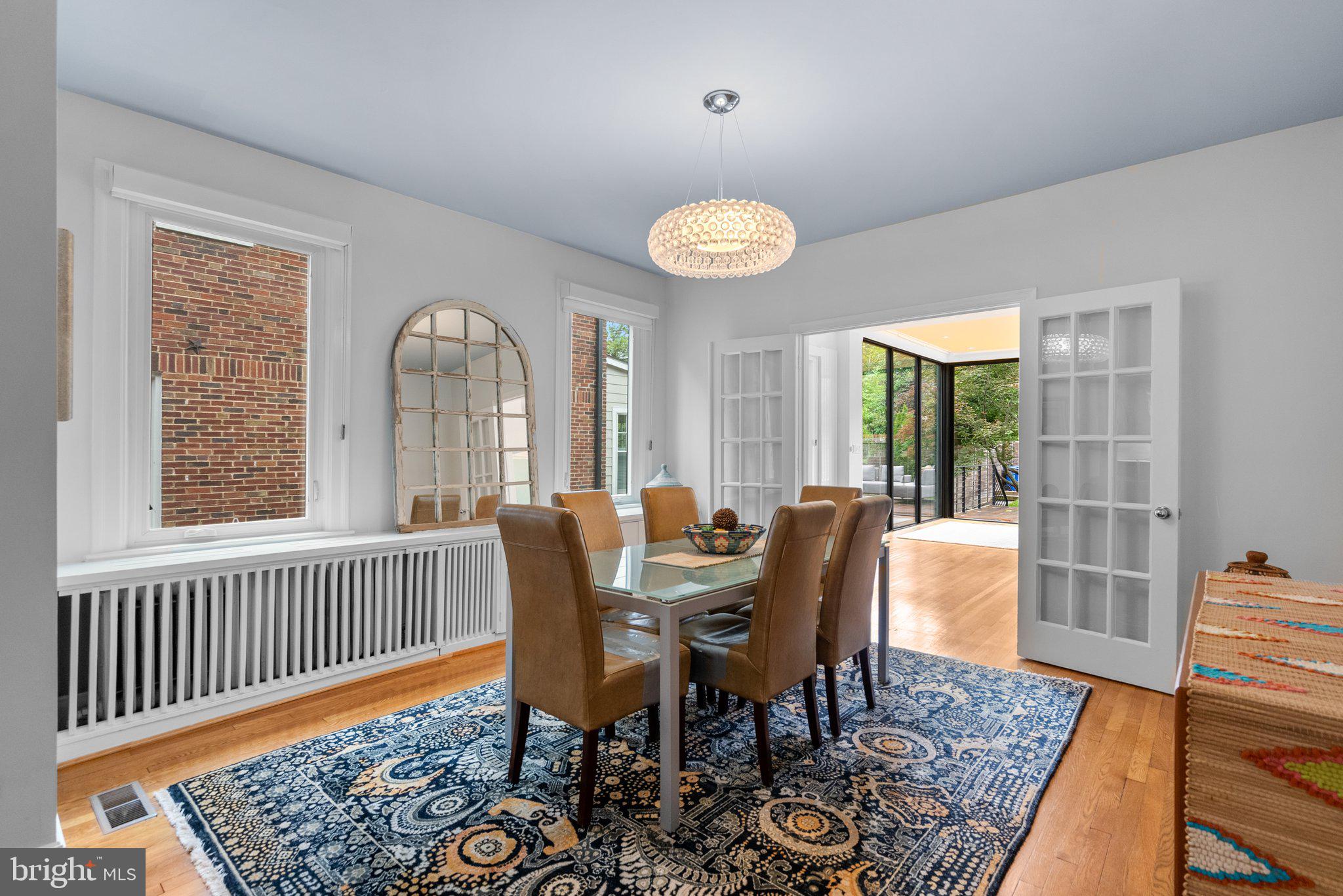 2815 39th Street Northwest Washington, DC 20007 - Photo 9 of 64 a view of a dining room with furniture window and wooden floor