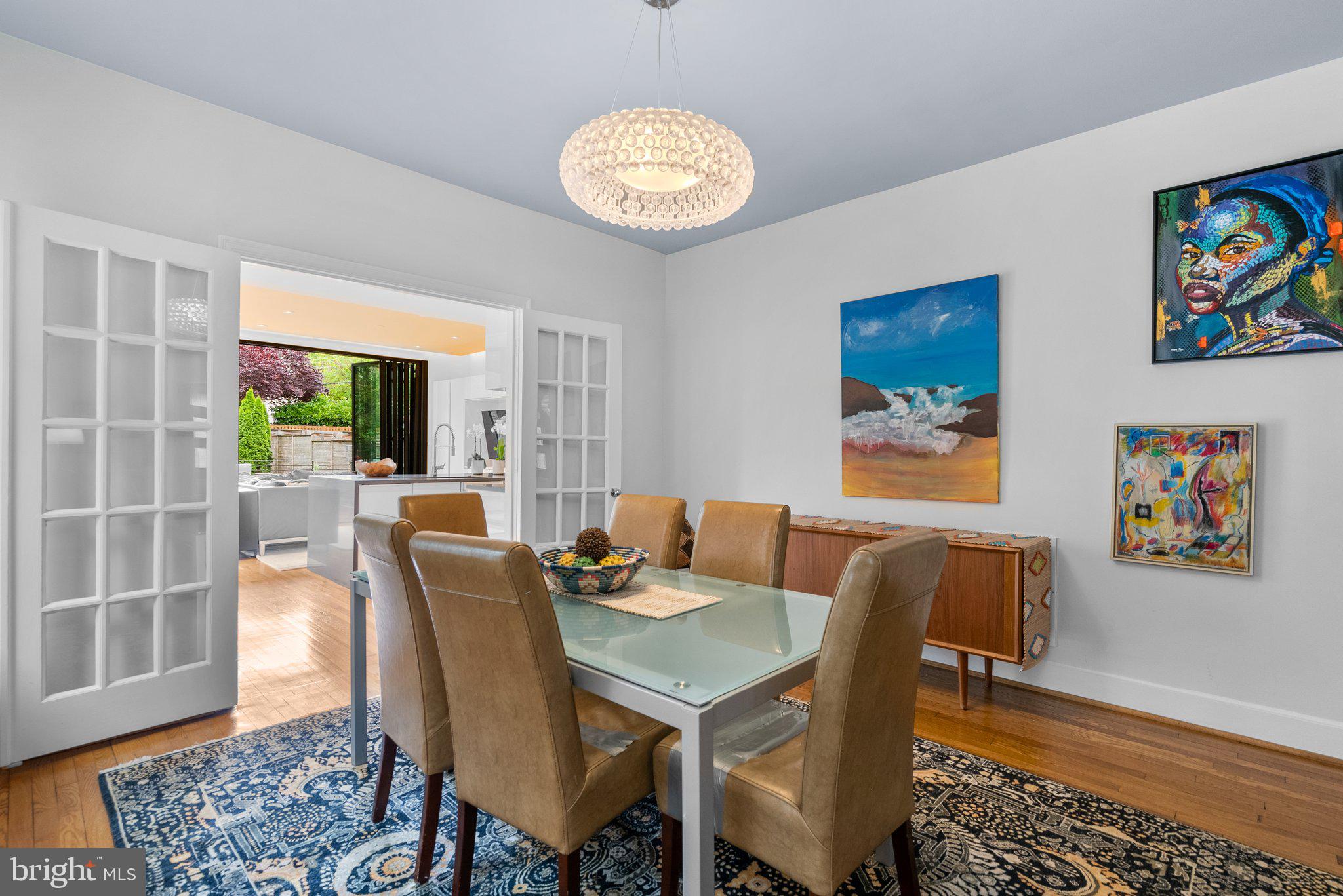 2815 39th Street Northwest Washington, DC 20007 - Photo 10 of 64 a view of a dining room with furniture a rug and wooden floor