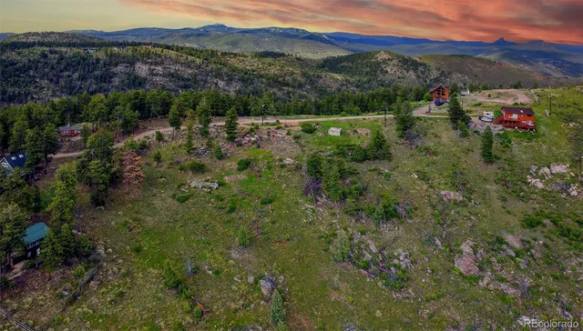 a view of a town with mountains in the background