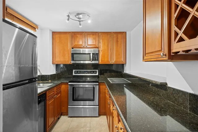 a kitchen with a refrigerator and a sink