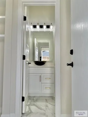 a bathroom with a toilet sink and shower