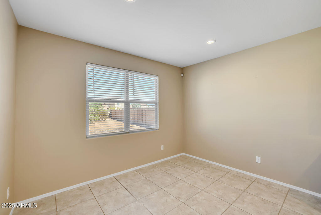 28414 Cinnabar Road San Tan Valley, AZ 85143 - Photo 13 of 32 an empty room with a window