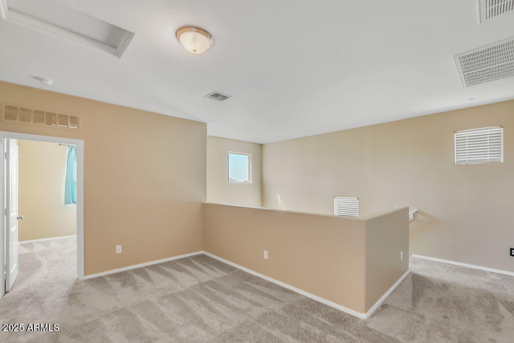 28414 Cinnabar Road San Tan Valley, AZ 85143 - Photo 15 of 32 a view of an empty room with a window