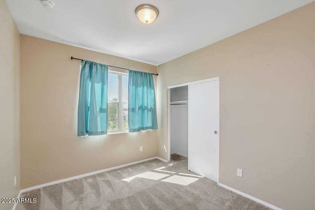 28414 Cinnabar Road San Tan Valley, AZ 85143 - Photo 16 of 32 a view of an empty room with a window