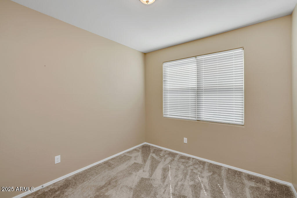 28414 Cinnabar Road San Tan Valley, AZ 85143 - Photo 17 of 32 a view of an empty room with a window