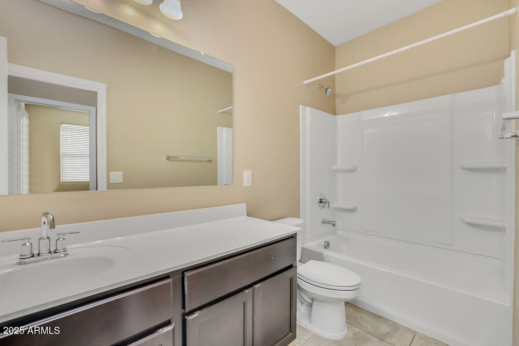 28414 Cinnabar Road San Tan Valley, AZ 85143 - Photo 18 of 32 a bathroom with a sink a toilet and shower