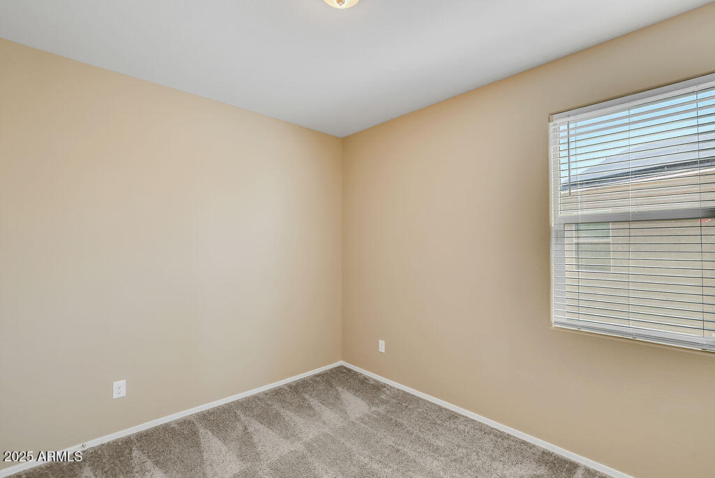 28414 Cinnabar Road San Tan Valley, AZ 85143 - Photo 20 of 32 an empty room with a window