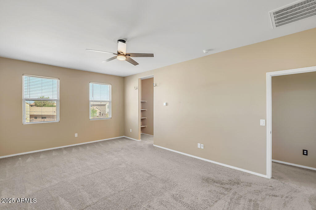 28414 Cinnabar Road San Tan Valley, AZ 85143 - Photo 22 of 32 a view of an empty room with a window