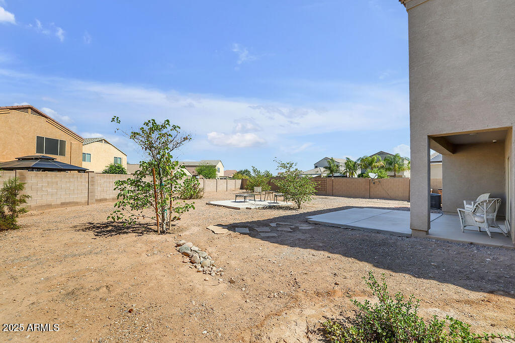 28414 Cinnabar Road San Tan Valley, AZ 85143 - Photo 27 of 32 a view of a house with a patio