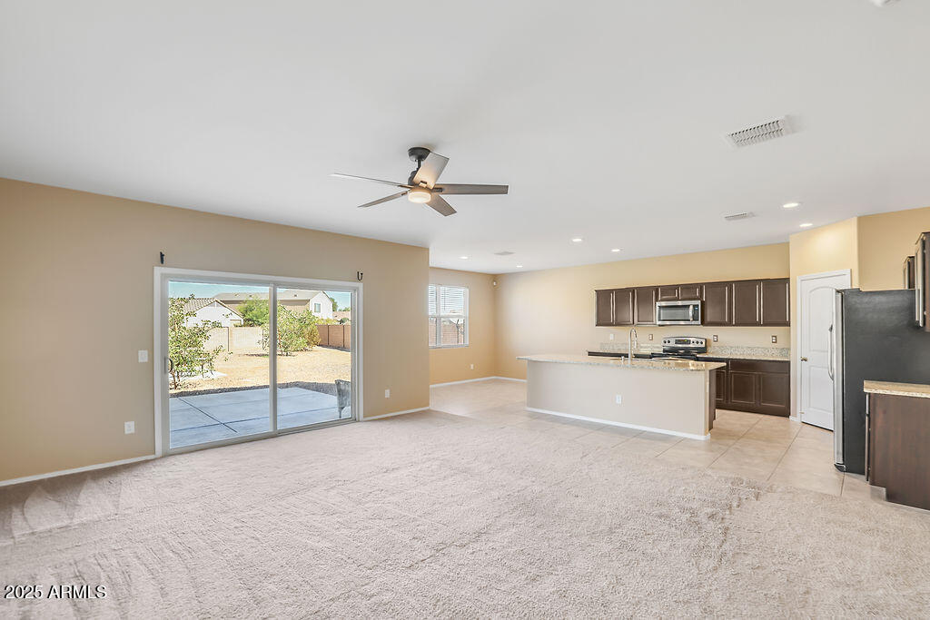 28414 Cinnabar Road San Tan Valley, AZ 85143 - Photo 5 of 32 a view of a kitchen with a sink and microwave