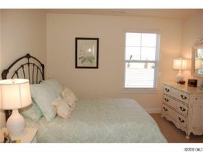 519 Jetton Street Davidson, NC 28036 - Photo 11 of 13 a bedroom with a bed and a window