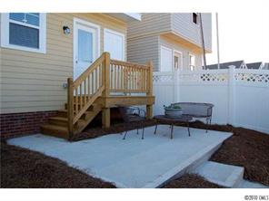 519 Jetton Street Davidson, NC 28036 - Photo 13 of 13 a view of a house with backyard and deck
