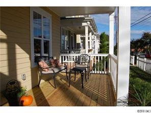 519 Jetton Street Davidson, NC 28036 - Photo 2 of 13 a view of a patio with table and chairs and potted plants