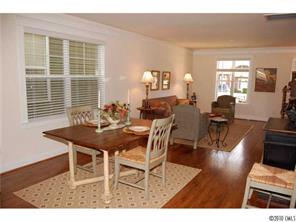519 Jetton Street Davidson, NC 28036 - Photo 5 of 13 a view of a dining room with furniture and wooden floor