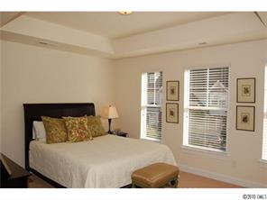 519 Jetton Street Davidson, NC 28036 - Photo 8 of 13 a bedroom with a large bed and a window