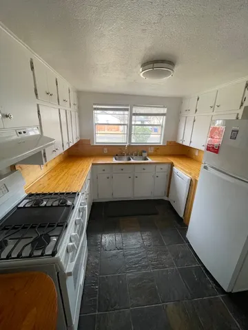a kitchen with a stove and a sink