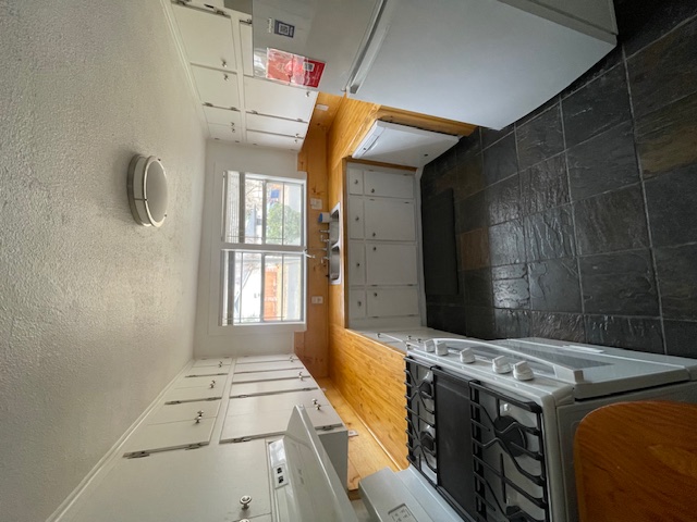 1105 1/2 Tillery Street Austin, TX 78702 - Photo 11 of 19 a kitchen with a stove and a sink