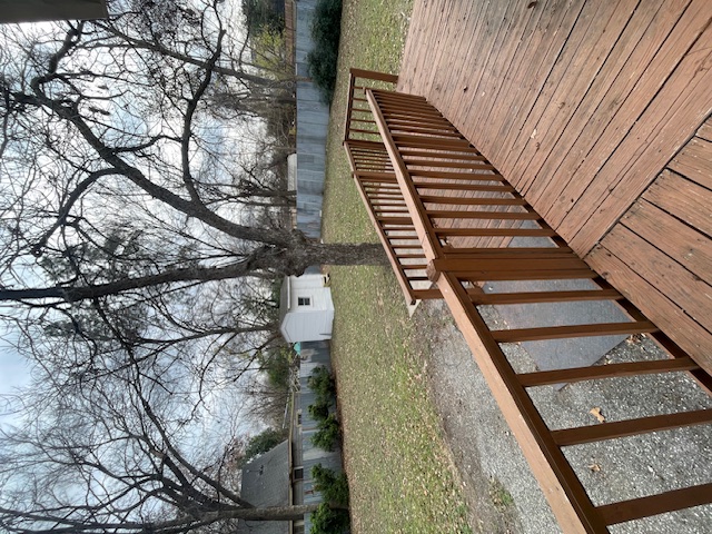 1105 1/2 Tillery Street Austin, TX 78702 - Photo 15 of 19 a view of wooden deck and lake with trees in the background