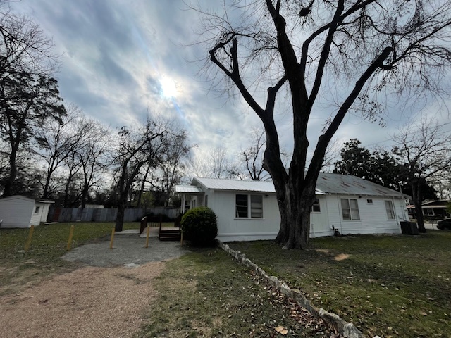 1105 1/2 Tillery Street Austin, TX 78702 - Photo 16 of 19 a view of a house with a yard