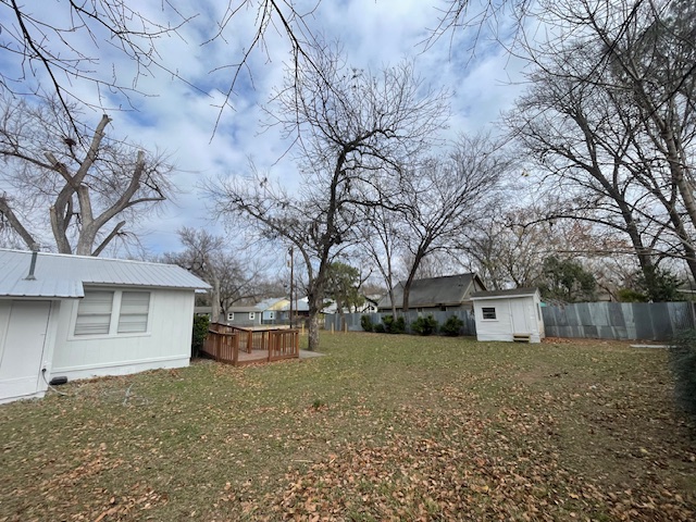 1105 1/2 Tillery Street Austin, TX 78702 - Photo 17 of 19 a front view of house with a yard