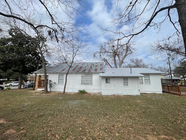 1105 1/2 Tillery Street Austin, TX 78702 - Photo 18 of 19 a front view of house with a yard