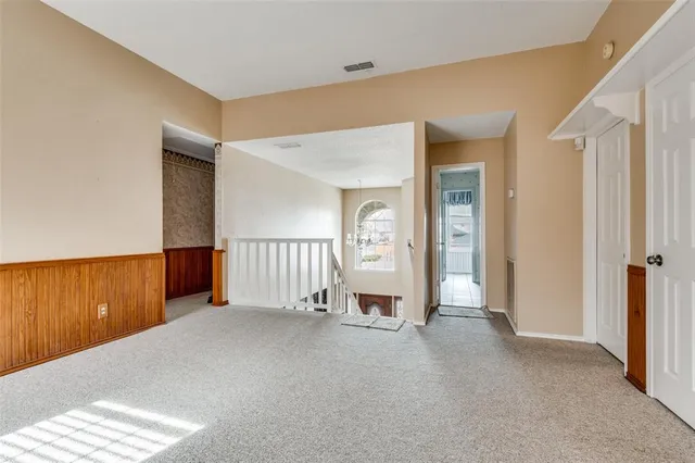 a view of a kitchen from a hallway