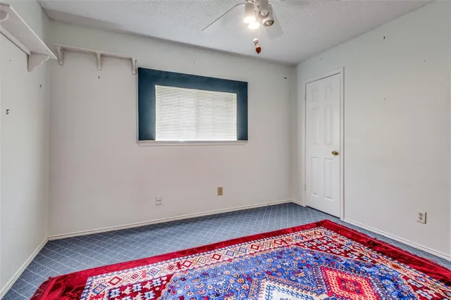 a view of an entryway with a floor to ceiling window