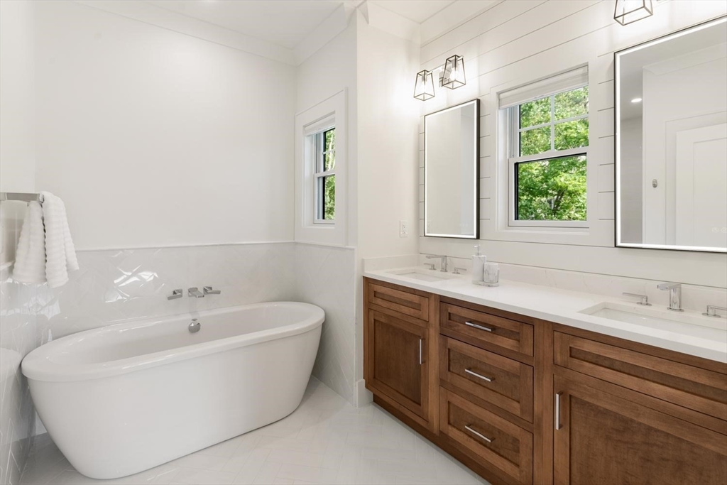 1124 Chestnut Street Newton, MA 02464 - Photo 18 of 41 a bathroom with a bathtub and a sink